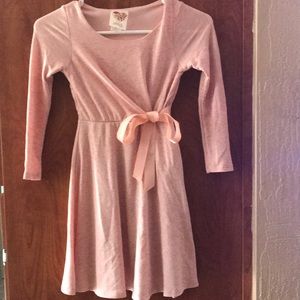 This pink/grey dress has tied ribbon on the side.
